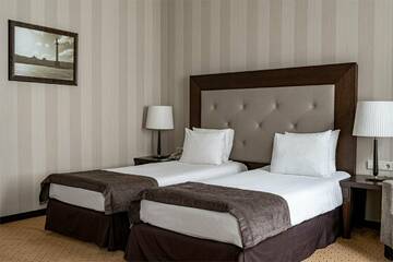 Улучшенный номер с одной большой или двумя раздельными кроватями в Гостинице Петро Палас